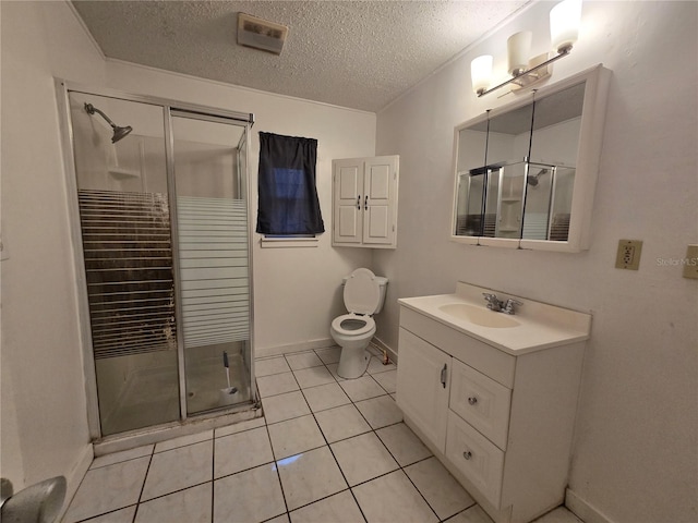 bathroom featuring visible vents, toilet, a textured ceiling, vanity, and a shower stall