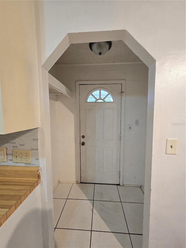 foyer with light tile patterned floors