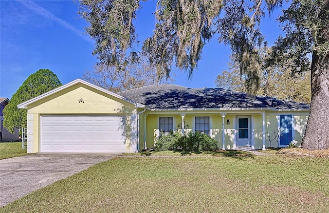 ranch-style home featuring a garage, a front yard, concrete driveway, and stucco siding