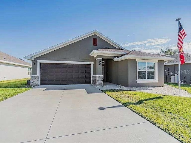 ranch-style home with a garage, driveway, stone siding, stucco siding, and a front lawn