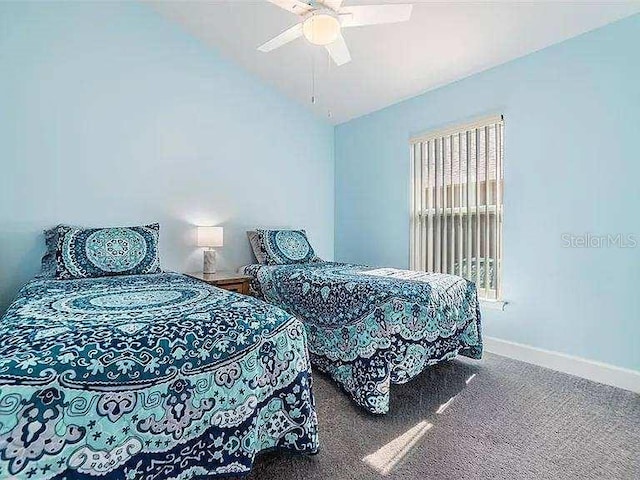 bedroom with lofted ceiling, carpet flooring, a ceiling fan, and baseboards