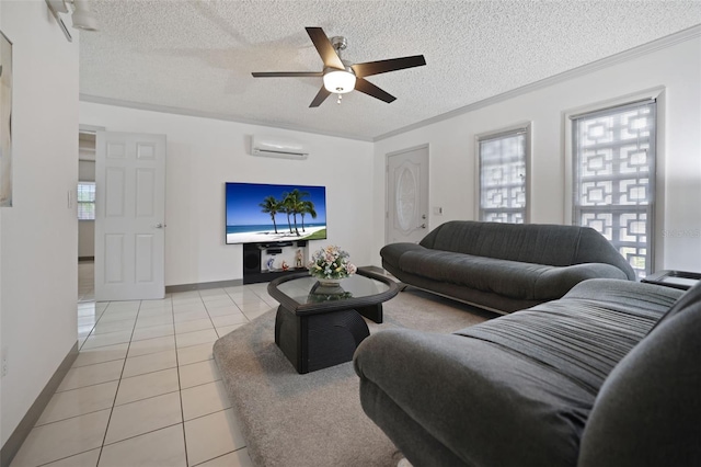 living room with a textured ceiling, light tile patterned flooring, a wall unit AC, and baseboards