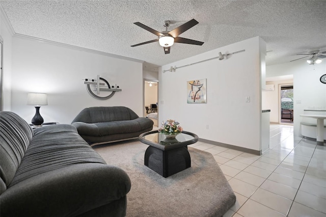 living area with a ceiling fan, a textured ceiling, baseboards, and light tile patterned floors