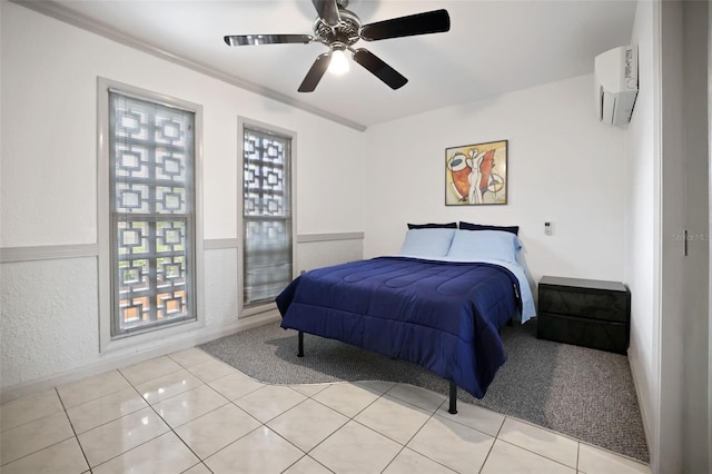 bedroom featuring light tile patterned flooring, a ceiling fan, and a wall mounted AC