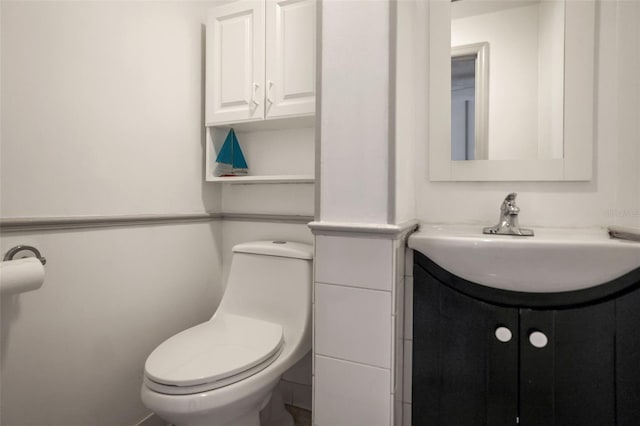 bathroom with vanity and toilet