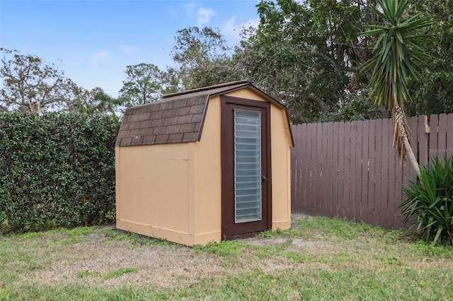 view of shed featuring fence private yard