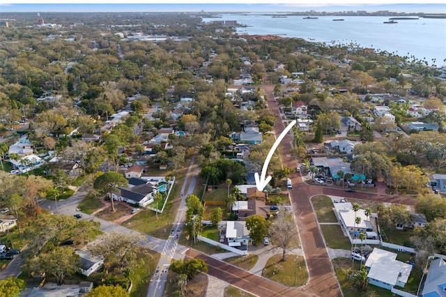 birds eye view of property featuring a water view and a residential view