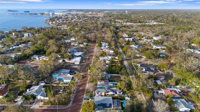 drone / aerial view with a residential view and a water view