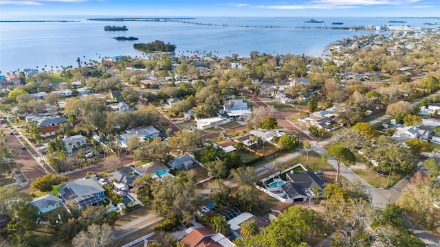 birds eye view of property with a water view and a residential view