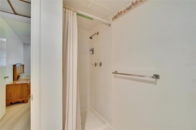 bathroom with a stall shower and ensuite bathroom