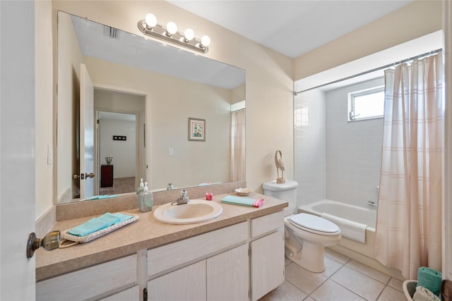 full bathroom with shower / bath combination with curtain, vanity, tile patterned flooring, and toilet