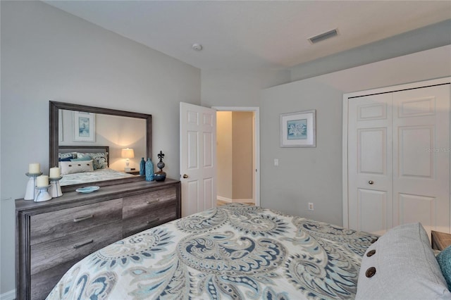 bedroom featuring visible vents and a closet