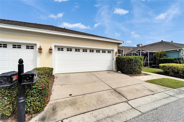 garage with concrete driveway