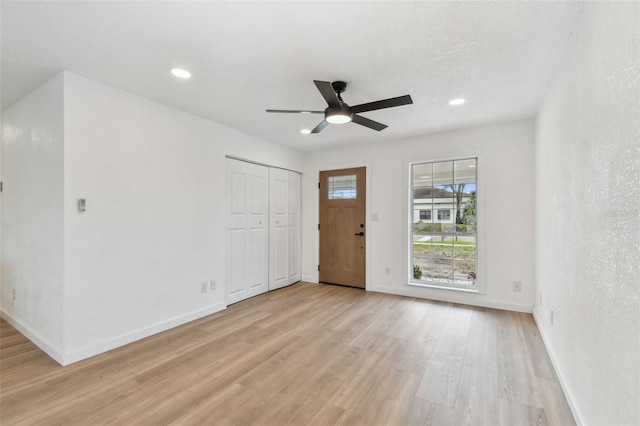 entryway with light wood-style floors, recessed lighting, ceiling fan, and baseboards