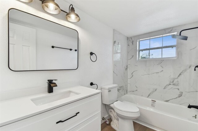 full bathroom with toilet, shower / bathtub combination, wood finished floors, and vanity