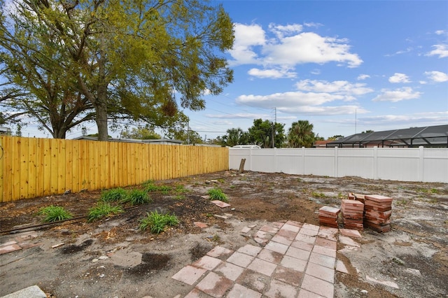 view of yard featuring a fenced backyard and a patio