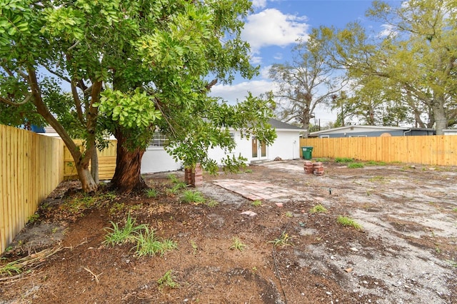 view of yard featuring a patio area and a fenced backyard