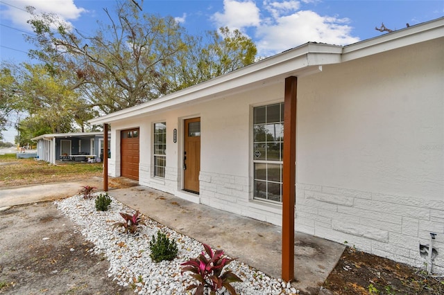 exterior space with a garage and concrete driveway