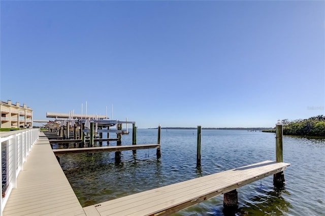 view of dock featuring a water view and boat lift