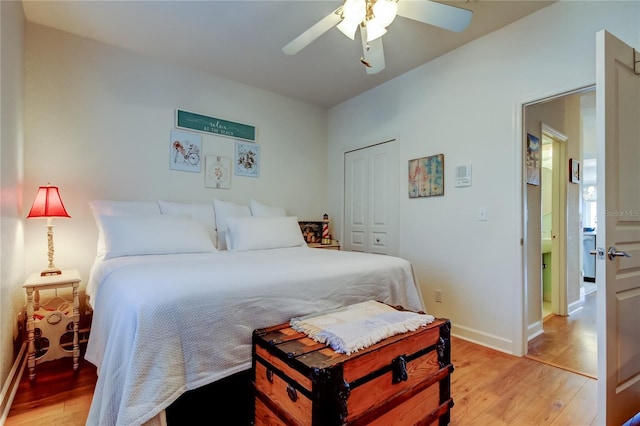 152 Brent Cir, Oldsmar, FL 34677 - bedroom featuring light wood-style floors, baseboards, a closet, and ceiling fan