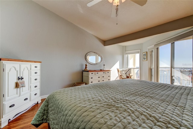 152 Brent Cir, Oldsmar, FL 34677 - bedroom with vaulted ceiling, baseboards, a ceiling fan, and wood finished floors