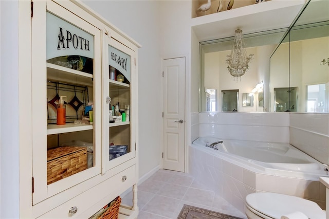 152 Brent Cir, Oldsmar, FL 34677 - bathroom with a garden tub, tile patterned floors, and a chandelier
