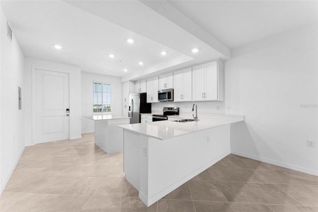 kitchen with visible vents, a sink, recessed lighting, appliances with stainless steel finishes, and light countertops