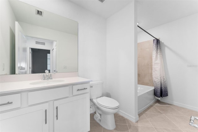 bathroom featuring tile patterned flooring, toilet, vanity, and visible vents