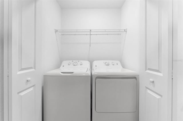 laundry room featuring laundry area and washer and clothes dryer