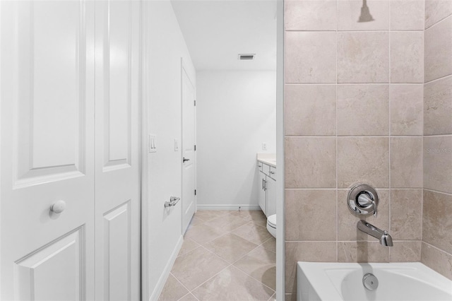 bathroom with visible vents, toilet, shower / tub combination, tile patterned floors, and vanity