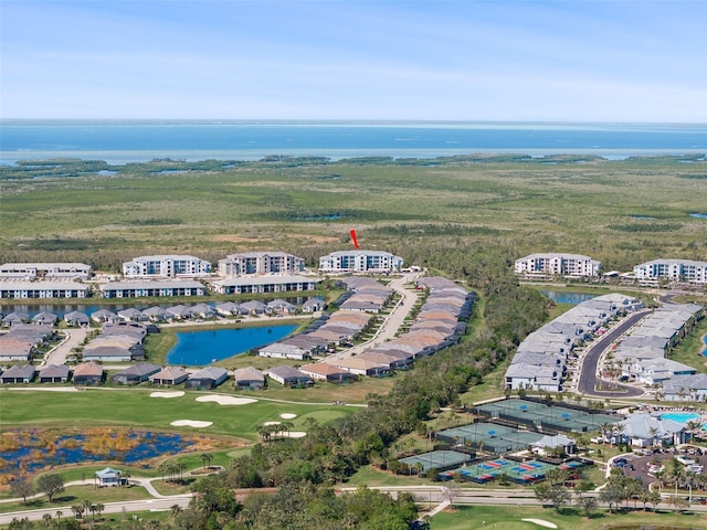 bird's eye view with a water view and golf course view