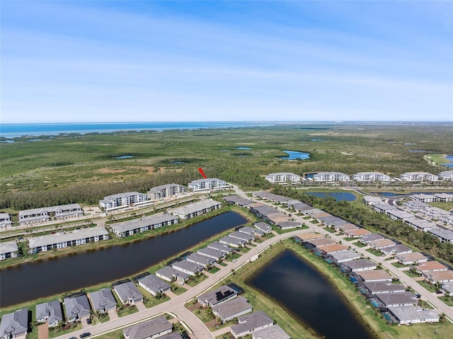 bird's eye view featuring a residential view and a water view