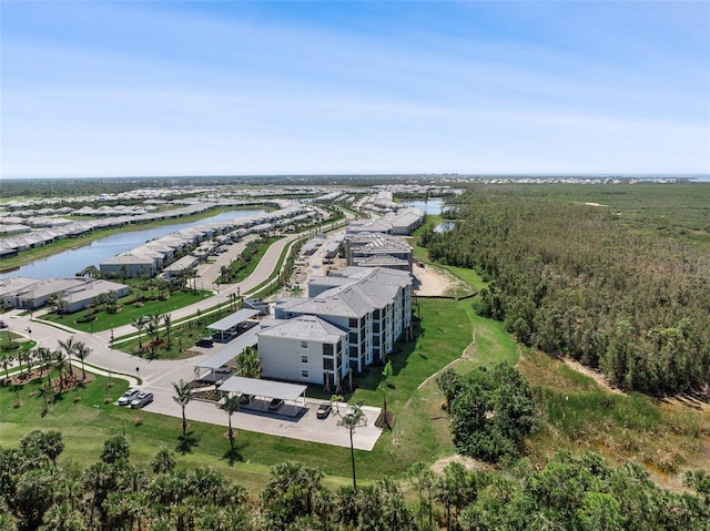 birds eye view of property with a water view