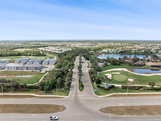 bird's eye view featuring view of golf course and a water view