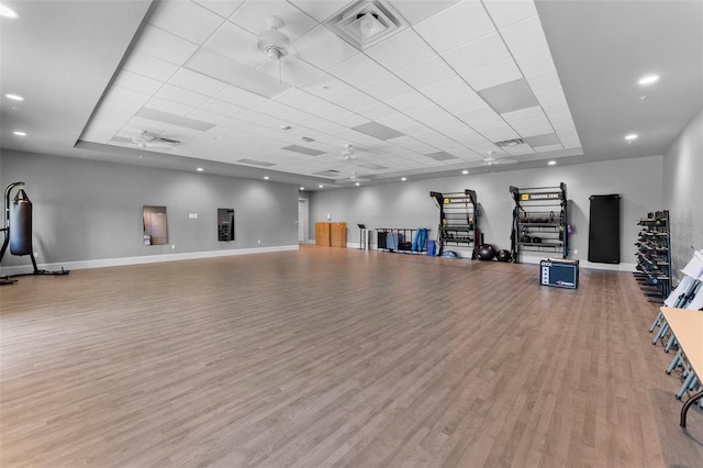 misc room with visible vents, wood finished floors, baseboards, and ceiling fan