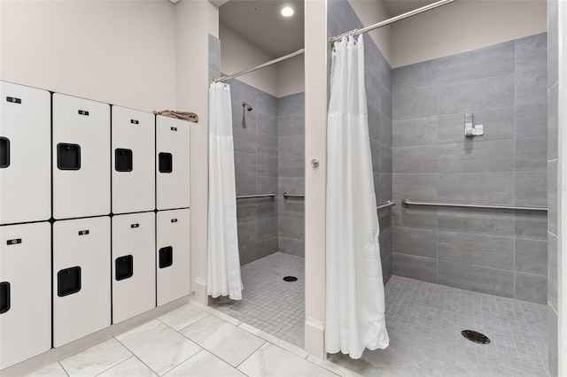 bathroom featuring tile patterned flooring and a stall shower