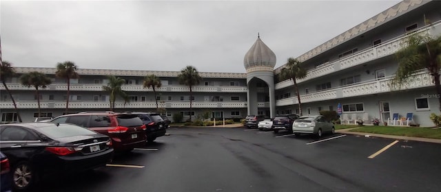 view of property with uncovered parking