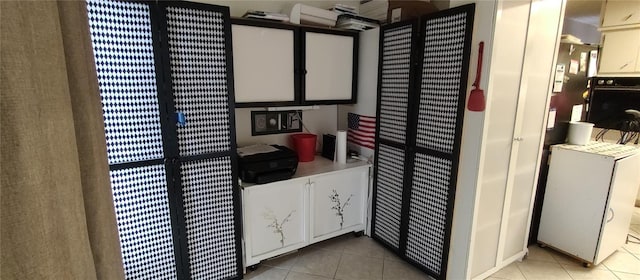 bathroom with tile patterned flooring and a heating unit