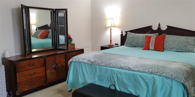 bedroom with light colored carpet