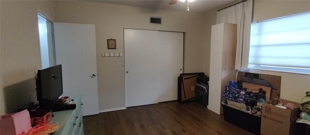 bedroom with wood finished floors and visible vents