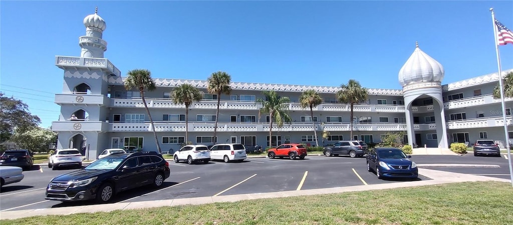 view of property with uncovered parking