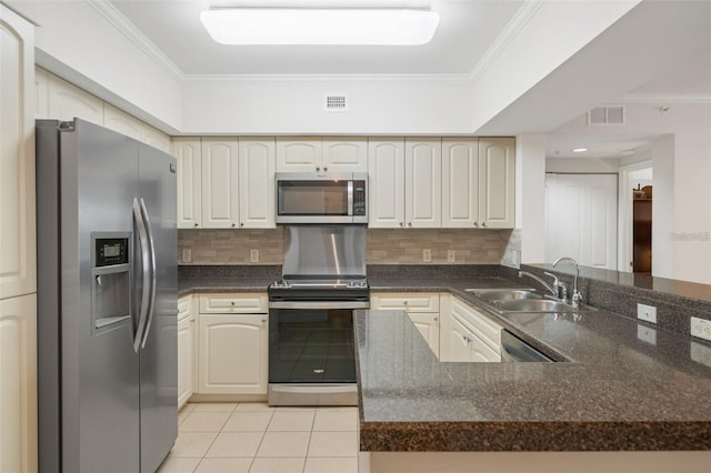 kitchen with visible vents, ornamental molding, a peninsula, stainless steel appliances, and a sink