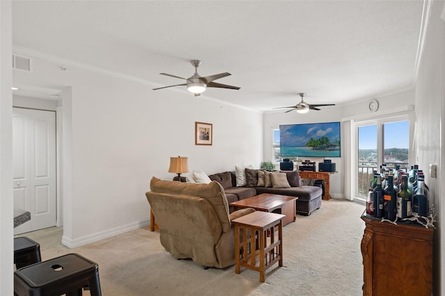 living area with light carpet, crown molding, baseboards, and ceiling fan