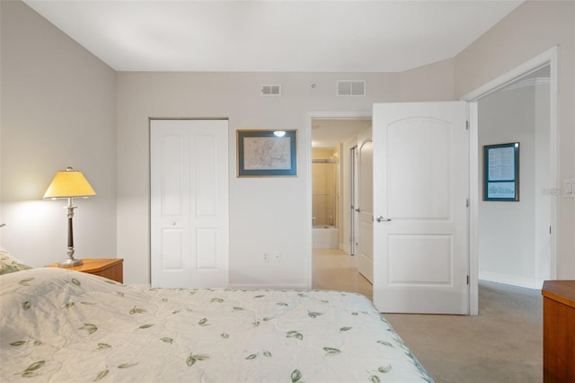 bedroom with a closet, visible vents, and light carpet