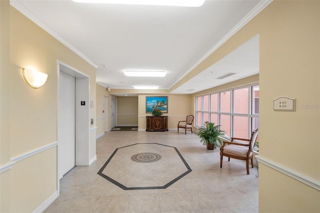 interior space featuring elevator, visible vents, crown molding, and baseboards