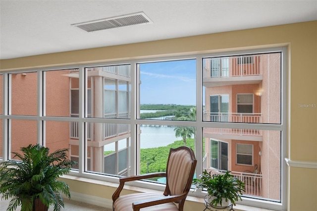 interior space featuring a water view and visible vents