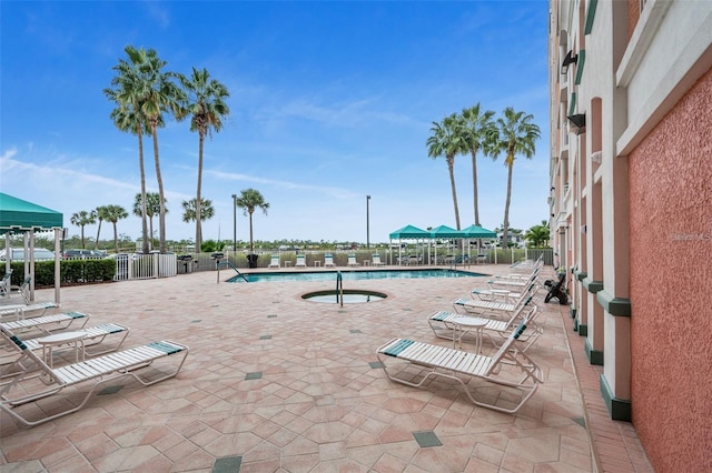 pool featuring a patio area and fence