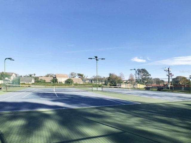 view of sport court with fence