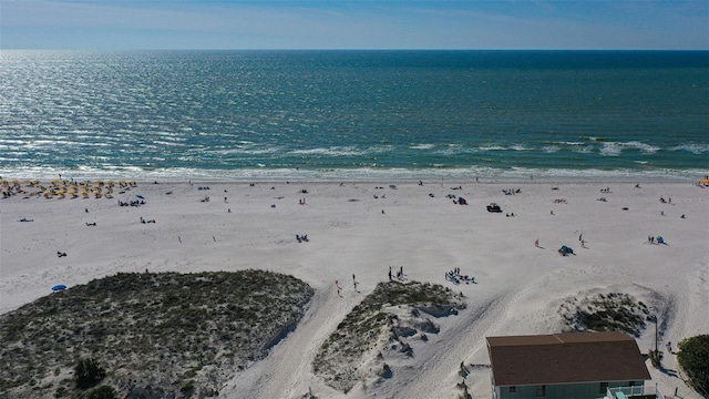 birds eye view of property with a water view and a view of the beach