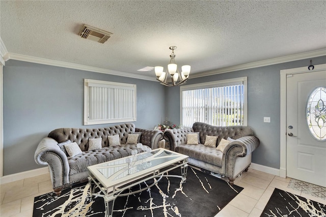 living area featuring a wealth of natural light, visible vents, and crown molding